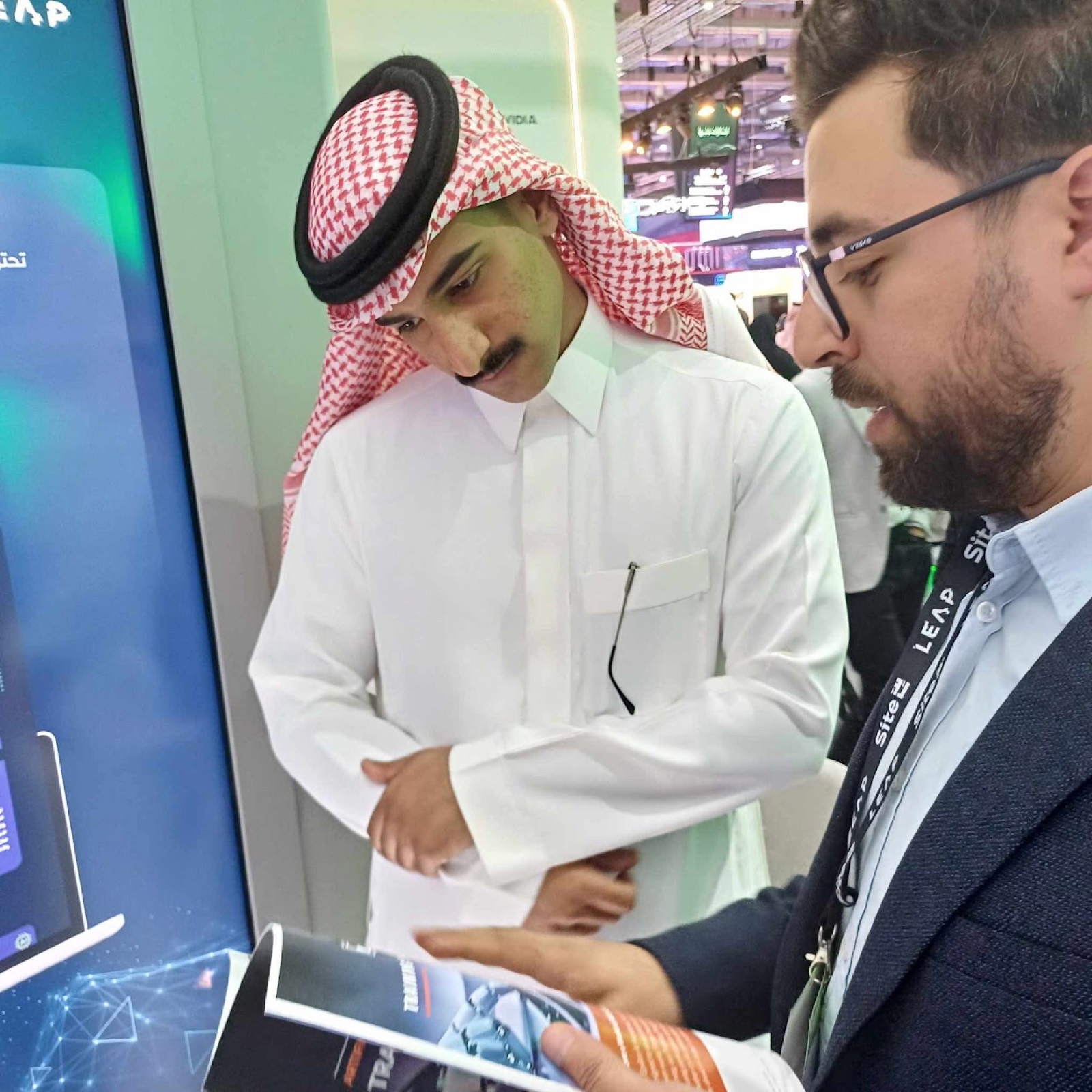 Epsilon at LEAP Riyadh 2025 showing the platform to a visitor